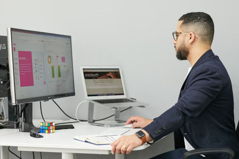 An influencer marketer sits in front of a desktop, planning content.
